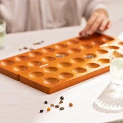 Navaris Mankala Houten Bordspel - Spel Voor Kinderen Vanaf 6 Jaar - Kalaha Strategiespel Voor Twee Spelers - 44 X 25 X 2 Cm -Spellen-Voor-Volwassenen Winkel 550x550 222